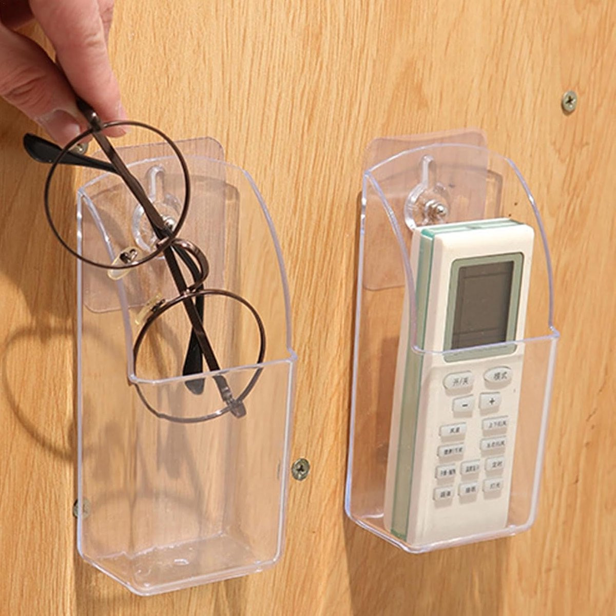 Transparante wandorganizer voor het opbergen van afstandsbedieningen met zelfklevende wandmontage