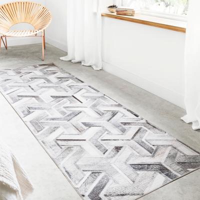 Alexander Home Davide Printed Faux Cowhide Area Rug