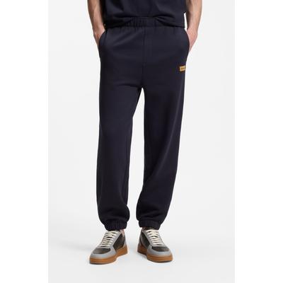 Sweathose HUGO "Nevatro", Herren, Gr. S, N-Gr, blau (dunkelblau405), Sweatware, Obermaterial: 100% Baumwolle, unifarben, regular fit lang, Hosen Sweathose, Regular Fit, Zierhosenschlitz, elastische Bündchen