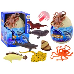 Ei mit Figuren von Meerestieren, Pflanzen und einem Oktopus. Set mit 26 Teilen.