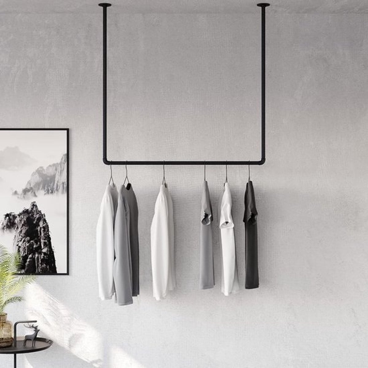 Industrieel kledingrek in loftdesign met waterleidingen voor wandmontage