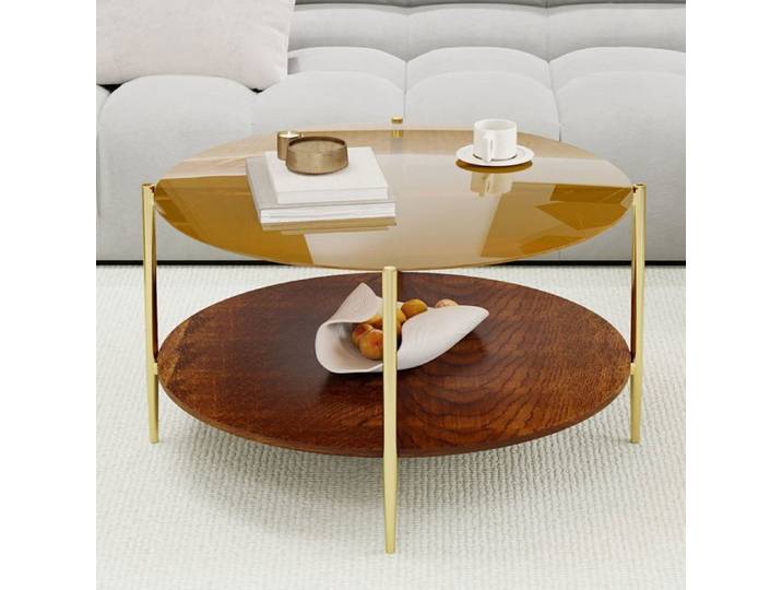 Table basse de salon minimaliste et moderne dotée d'un plateau rond en verre doré associé à une base en bois