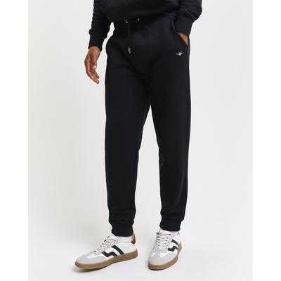 Sweathose GANT "REG SHIELD SWEATPANTS", Herren, Gr. M, N-Gr, schwarz, Web, Obermaterial: 87% Baumwolle, 13% Polyester, unifarben, regular fit knöchellang, Hosen Sweathose, mit Logostickerei unterhalb des Bunds