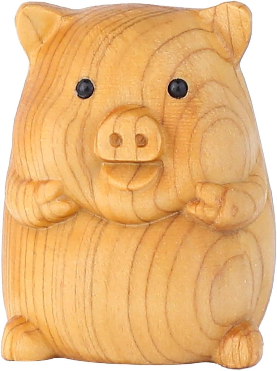 Handgesneden houten varkensbeeldje voor decoratie op tafel