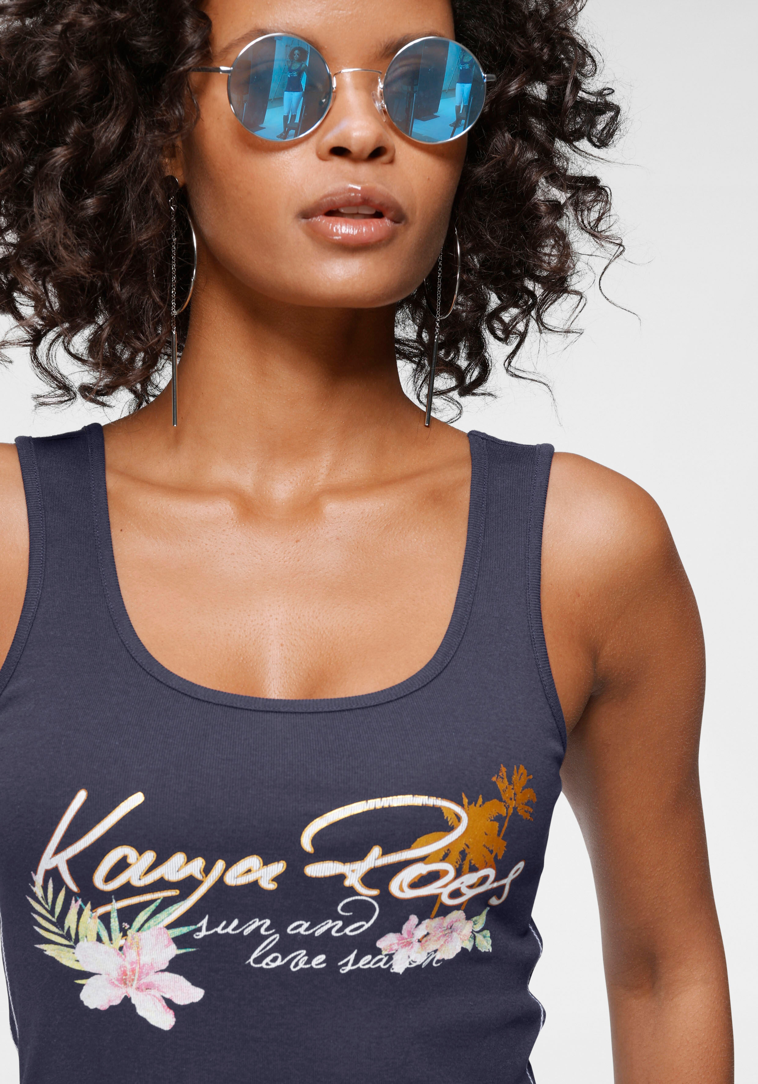 Tanktop KANGAROOS, Damen, Gr. 40/42, blau (marine), Rippware, Obermaterial: 100% Baumwolle, sehr figurbetont hüftlang, Rundhals, Tops Tanktop, mit femininem Frontdruck marine 40/42
