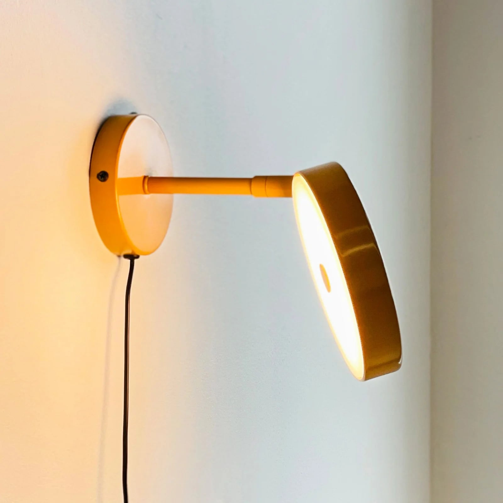Dyberg Larsen Starlight LED wandlamp, geel, Ø 14 cm, dimbaar