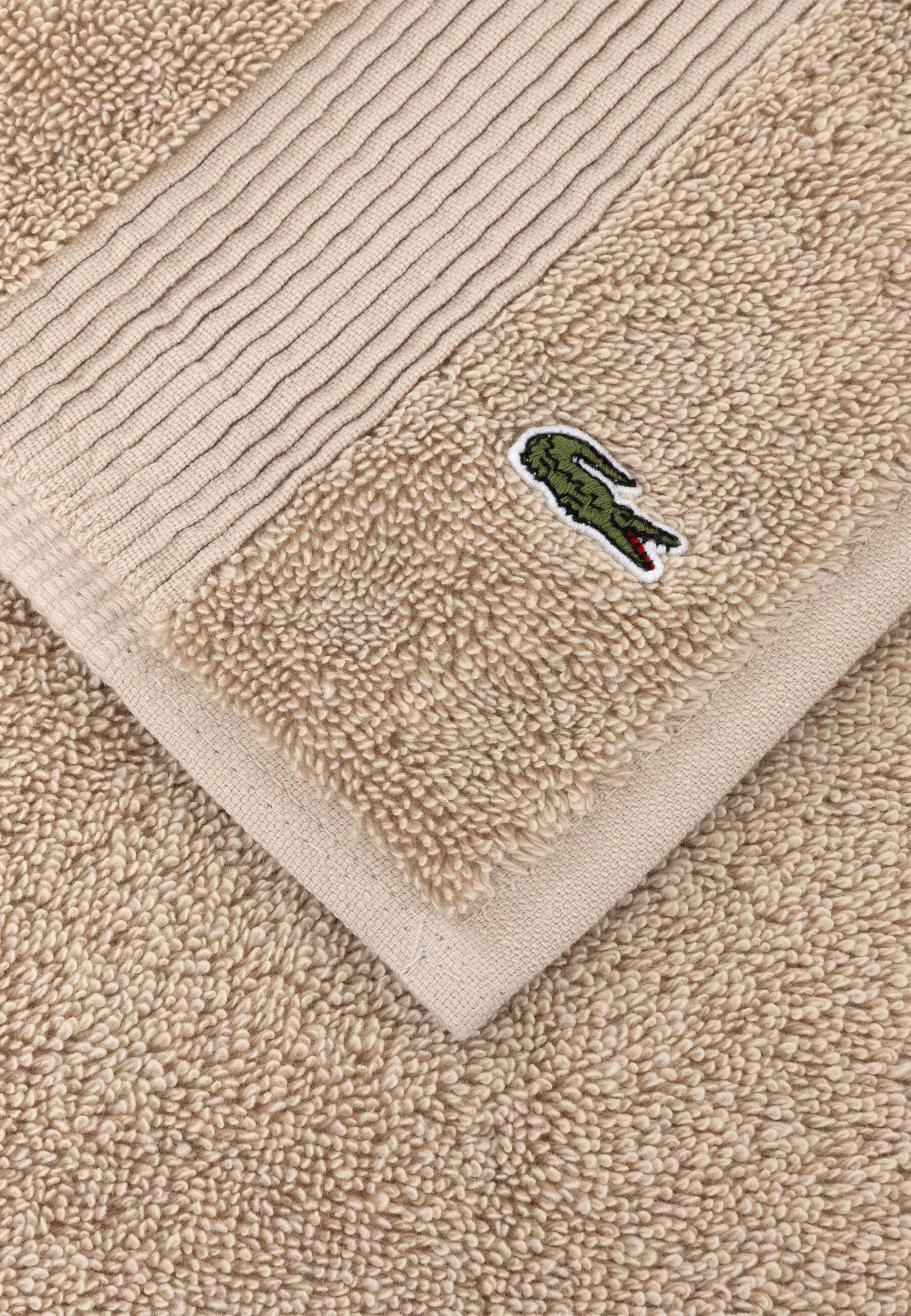 Badematte LACOSTE "LLECROCO", beige (cappuccino), H:3mm, Baumwolle, Badematten, Badematte, mit Label-Applikationen cappuccino (50cm x 70cm )