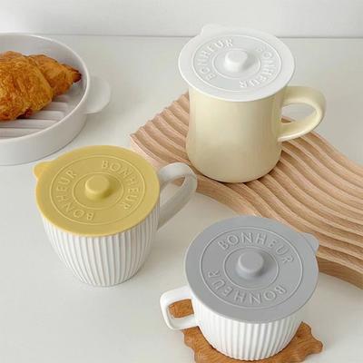 KitchenNation Simple Solid Color Concave Embossed Letter Silicone Rubber Lid, Creative Water Cup Dust Cup Lid, Round Cold Mug Lid yellow