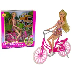 Puppe auf einem Fahrrad, Rosa