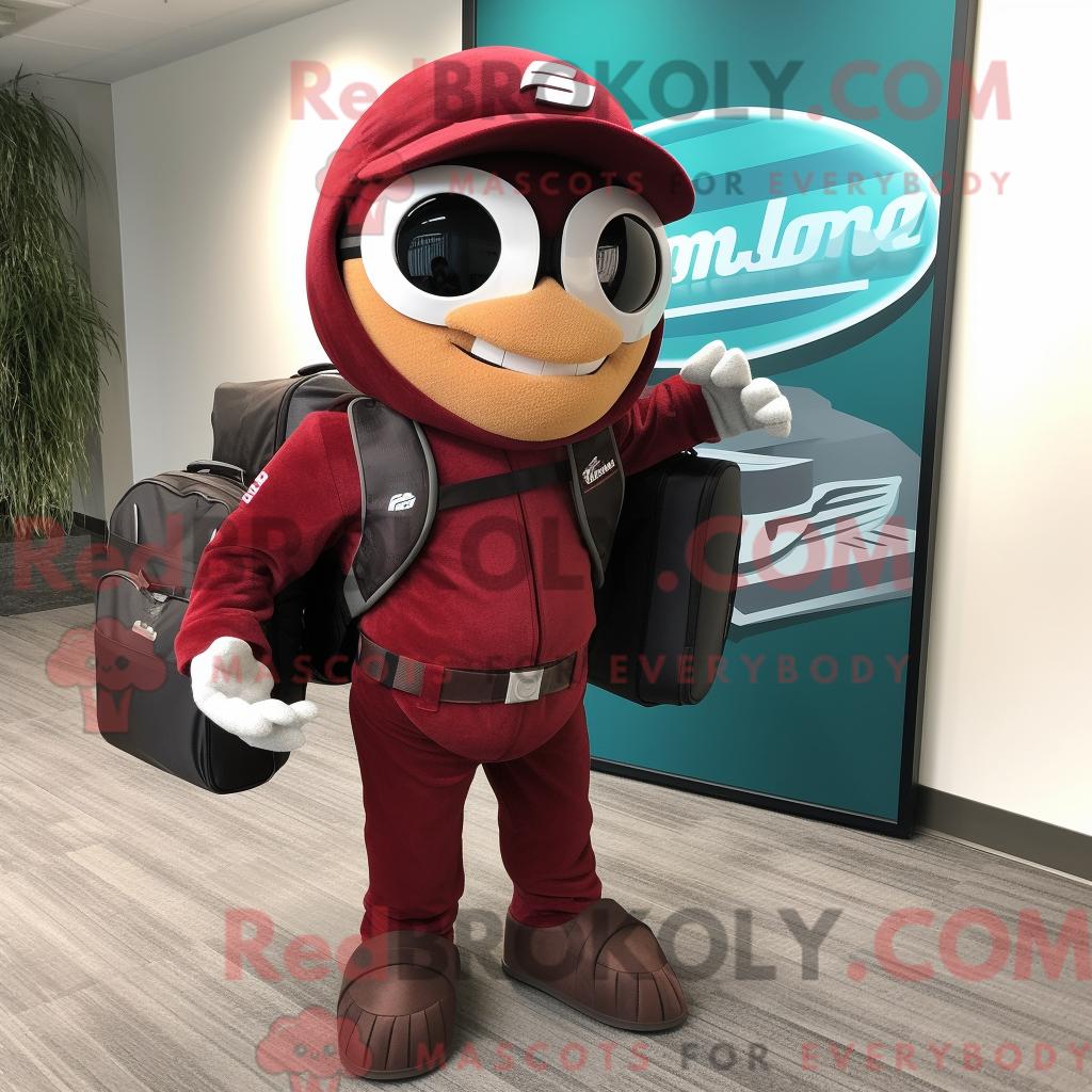 Maskottchenfigur REDBROKOLY eines kastanienbraunen Spinats mit Motorradjacke und Aktentasche