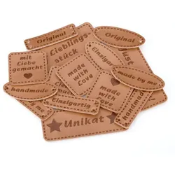 buttinette Label-Set "handmade", in Lederopitk, 3,5 – 7,5 cm, 15 Stück
