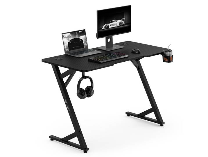 Bureau de jeu Sense7 VAMO\, 120x60 cm\, noir. Bureau d'ordinateur\, bureau PC\, design carbone\, forme en Z\, avec porte-boissons. Idéal pour le gaming\, le télétravail et le bureau à domicile