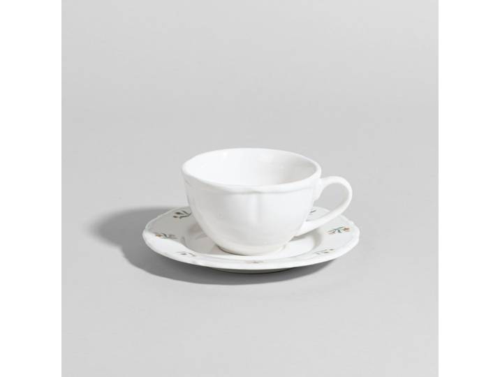 Weiße Porzellan-Kaffeetasse mit Mustern