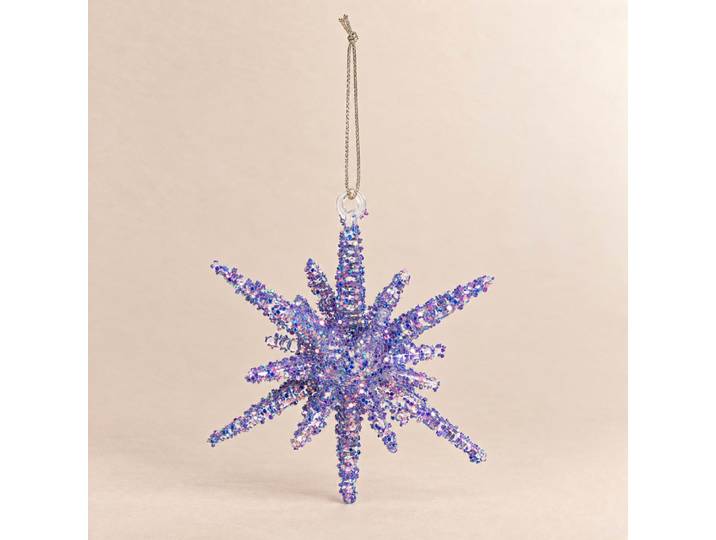 Mehrfarbiger, glitzernder Stern als Weihnachtsschmuck