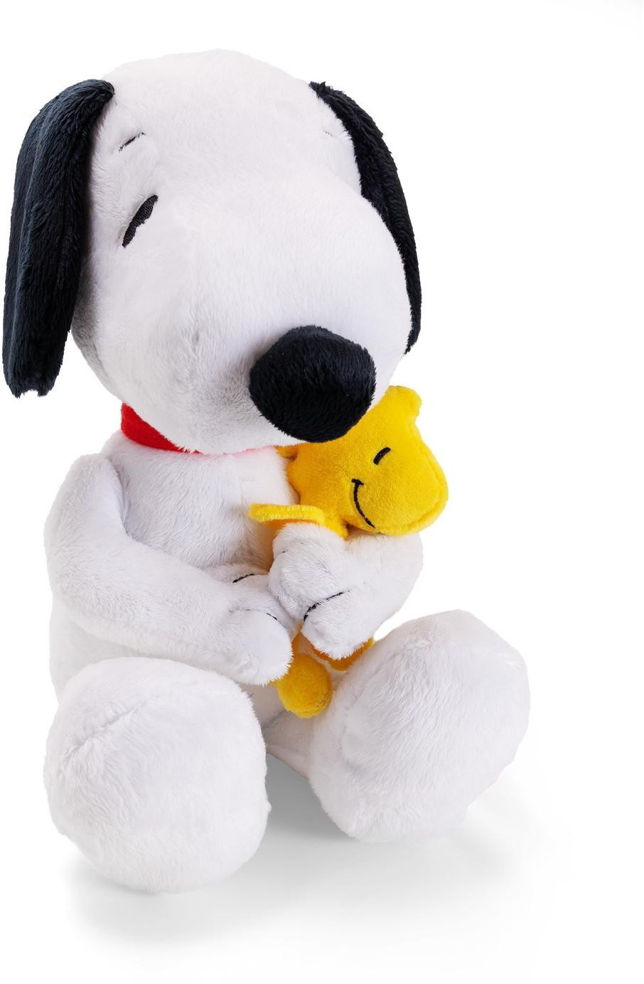 Simba Snoopy zittend met Woodstock snoepjes voor honden