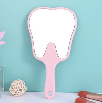 Inspire Curations Cute Tooth Shaped Handheld Makeup Mirror pink