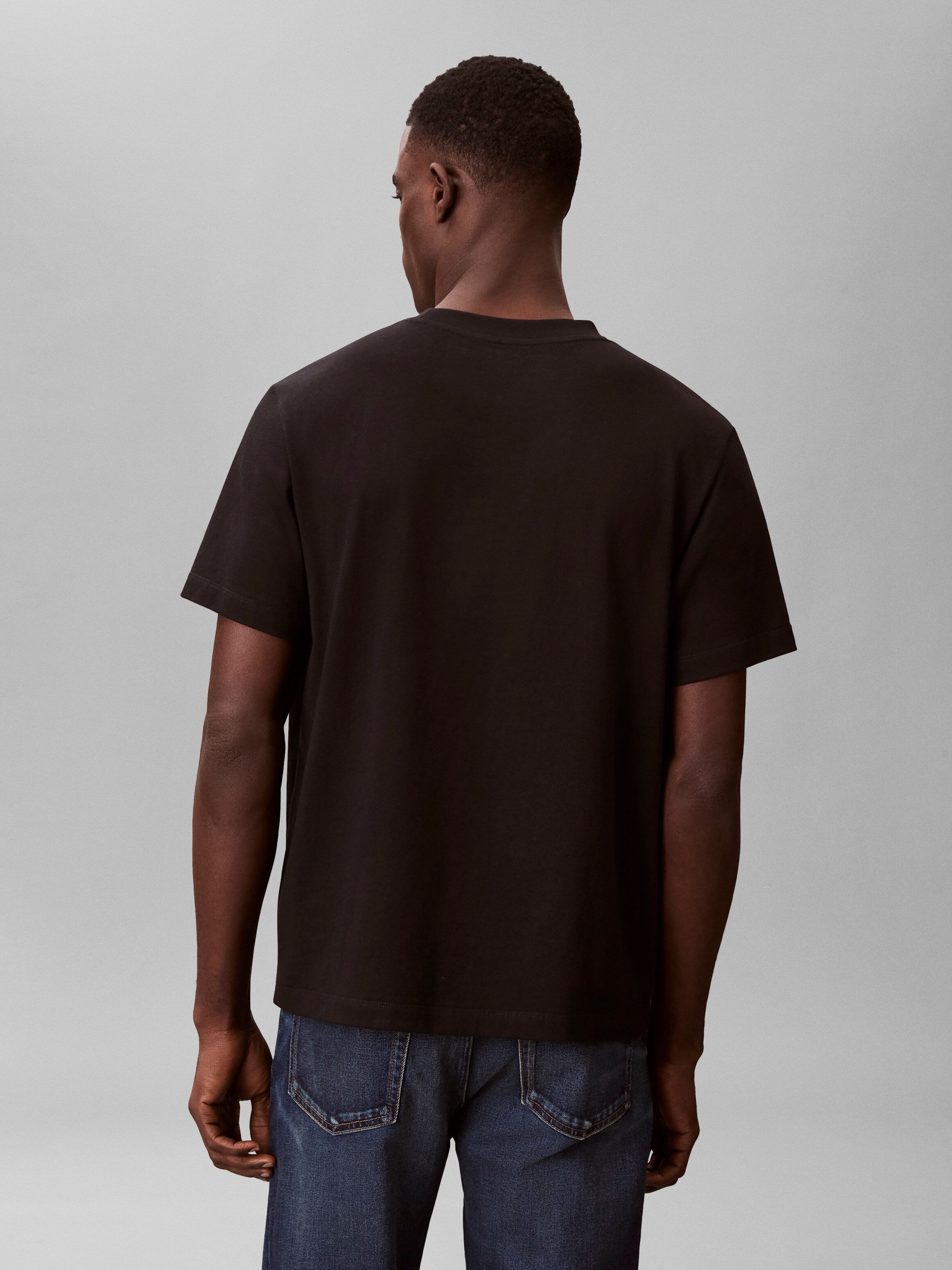 T-Shirt CALVIN KLEIN JEANS "20S EU WHOLESALE SPORTSWEAR GRAP", Herren, Gr. S, schwarz, Web, Obermaterial: 100% Baumwolle, unifarben, lässig geschnitten normal, Rundhals, eingesetzt abgesteppte Kante, Shirts T-Shirt, Regular fit mit Rundhalsausschnitt schw