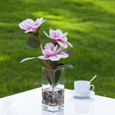 Enova Home Artificial Real Touch Magnolia Faux Flowers Arrangement in Rectangle Glass Vase with Faux Water and River Rock