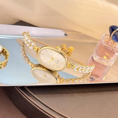 Youfap Market Best selling Elegant Leaf Embedded Diamond Quartz Watch, New Oval Pull Cord Fashion Bracelet gold