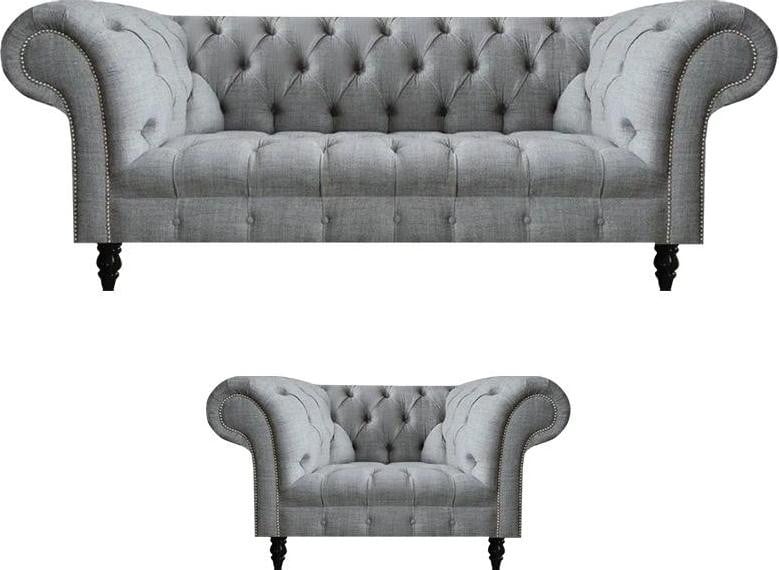 Moderne grijze zithoek bestaande uit een driezitsbank en een fauteuil