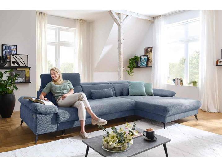 Ecksofa mit motorischen XL- Sitzvorzug in Stoff