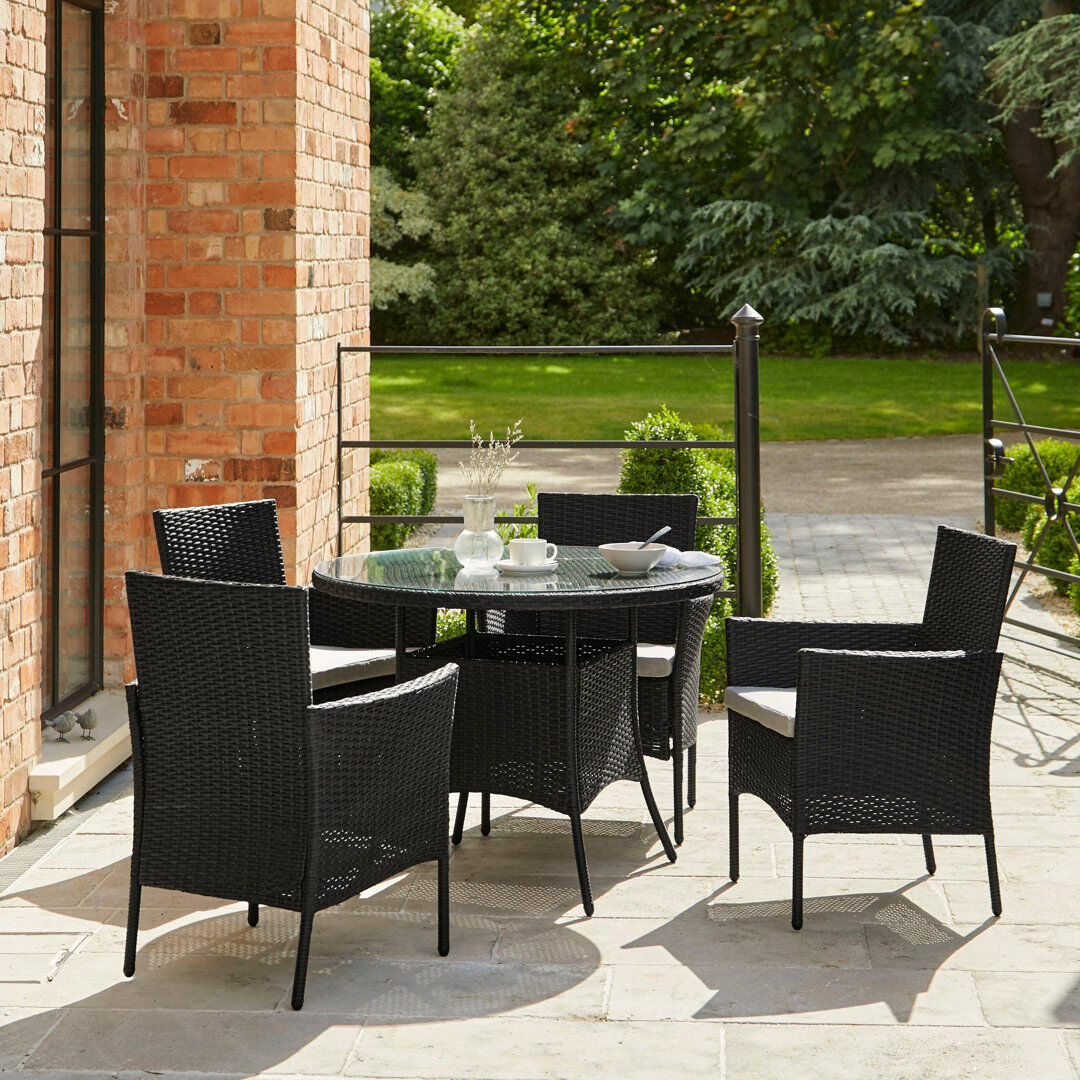 Lark Manor Dubose 4 - Person Patio Dining Set Umbrella Hole Included Round Table with Cushions Included Black 4