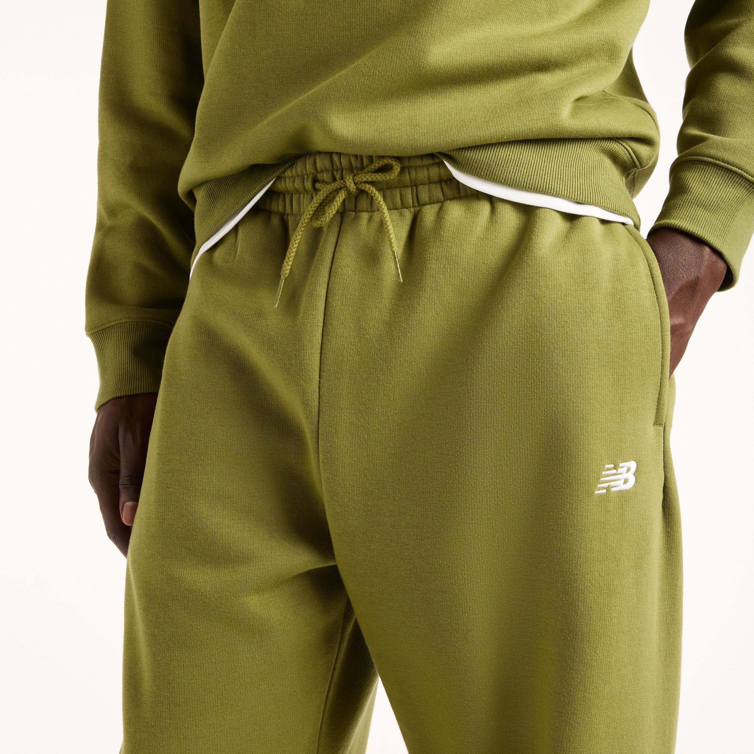 Jogginghose NEW BALANCE "SPORT ESSENTIALS FLEECE JOGGER", Herren, Gr. XL, N-Gr, grün (sport grün (gee)), Obermaterial: 60% Baumwolle, 40% Polyester, Hosen Jogginghose, mit Eingrifftaschen, aus Fleece, lockere Passform sport grün (gee) XL, N-Gr