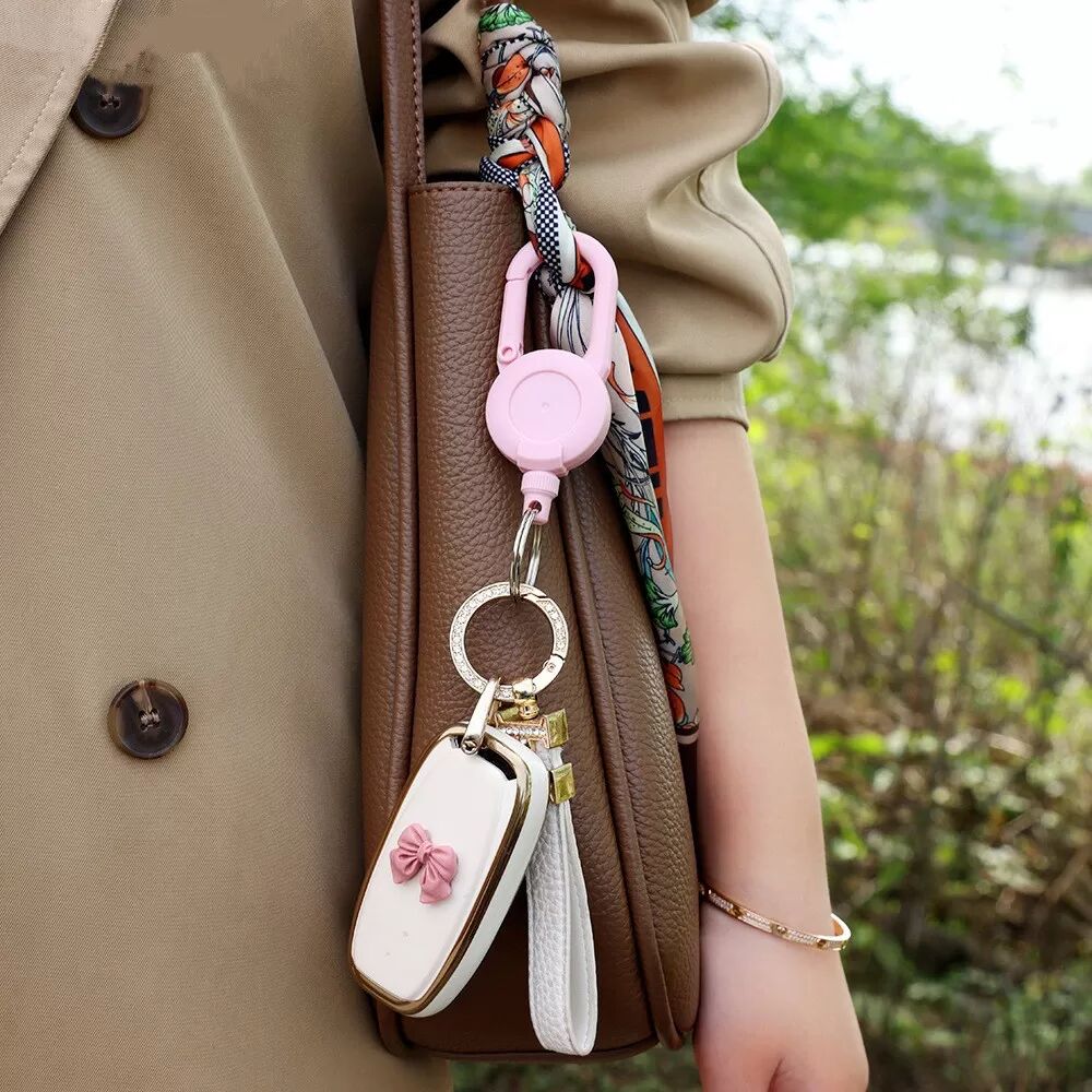 INF Einziehbarer Schlüsselanhänger Rosa