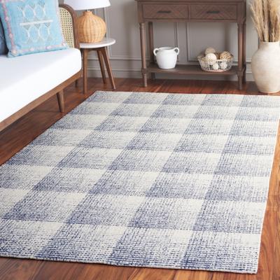 SAFAVIEH Hand-Tufted Ebony Uschi Modern & Contemporary Wool Rug