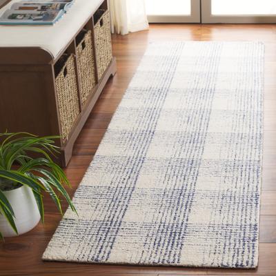 SAFAVIEH Hand-Tufted Ebony Uschi Modern & Contemporary Wool Rug