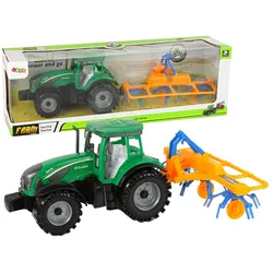 Grüner Traktor mit orangefarbener und blauer Harke Reibungsantrieb