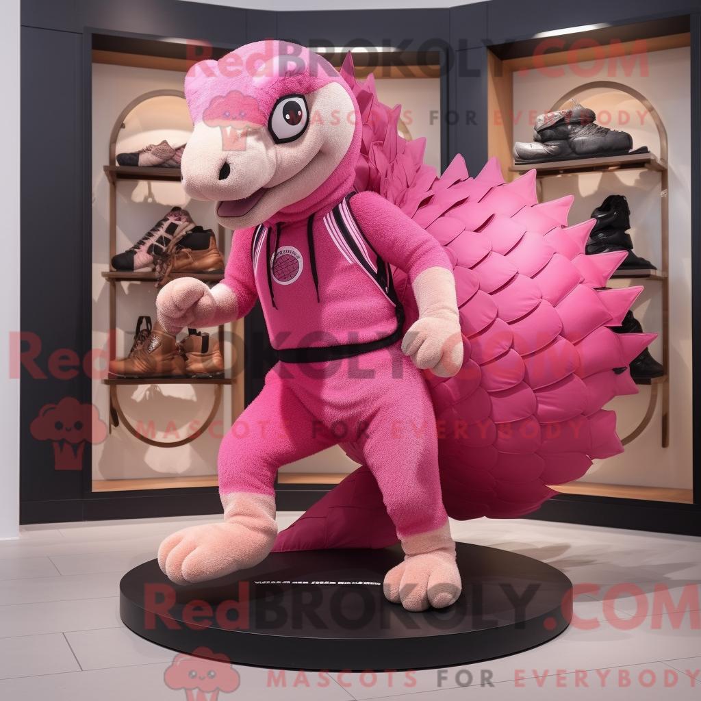 Maskottchen REDBROKOLY eines rosa Schuppentiers mit Laufshorts und Handtasche