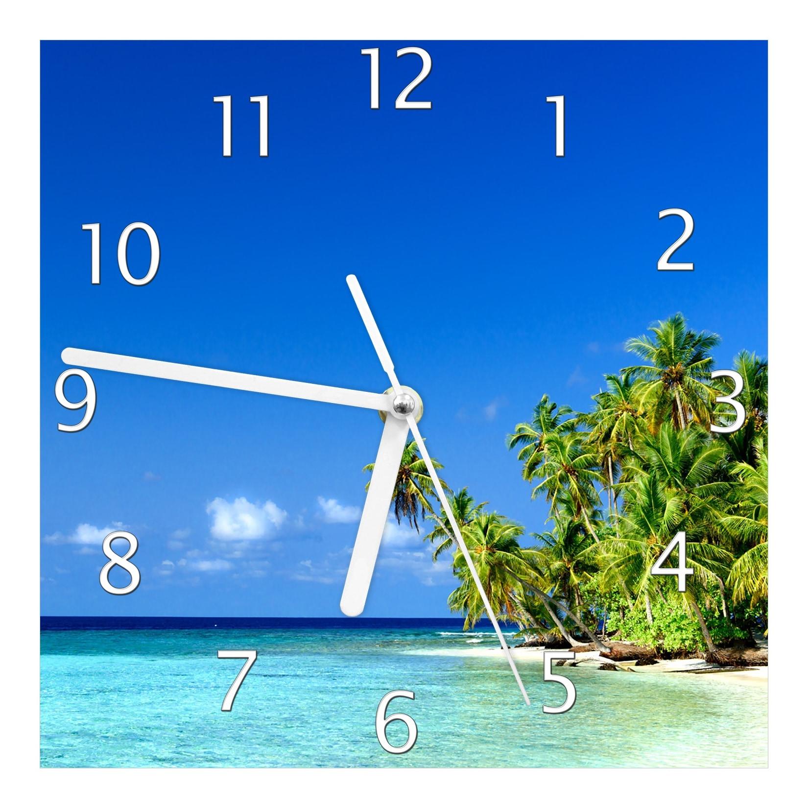 Wallario Uhr 30 x 60 cm, weiße Zeiger Blauer Himmel weißer Strand Palmen und das tiefblaue Meer