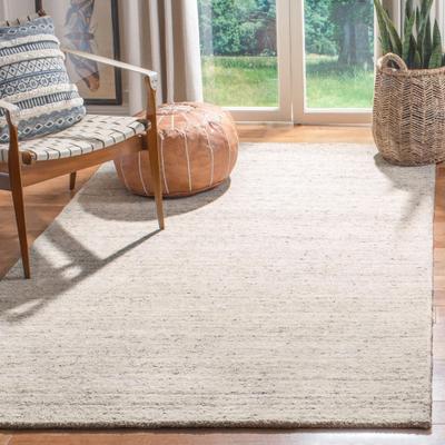 SAFAVIEH Handmade Himalaya Modern & Contemporary Solid Ivory Wool Rug
