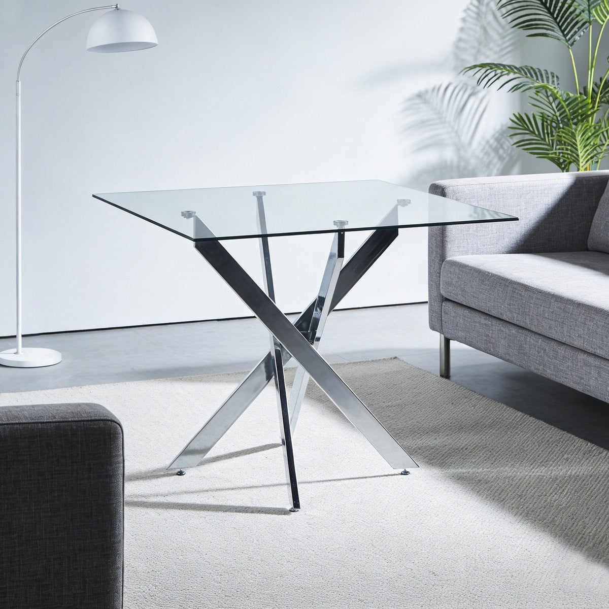 Wishdor Eettafel met glazen tafelblad en metalen kruispoten in zilver