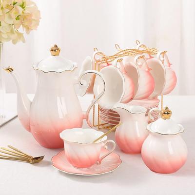 KitchenNation 22 Piece Porcelain Tea Set For 6 Luxury British Style Tea & Coffee Cups With Golden Trim gradient Pink