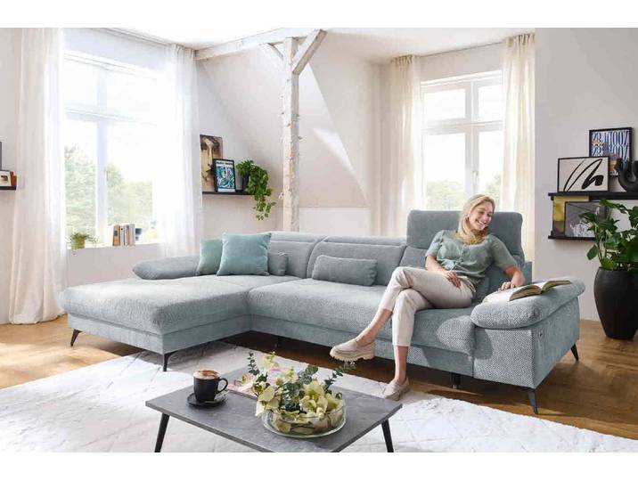 Ecksofa mit motorischen XL- Sitzvorzug in Stoff
