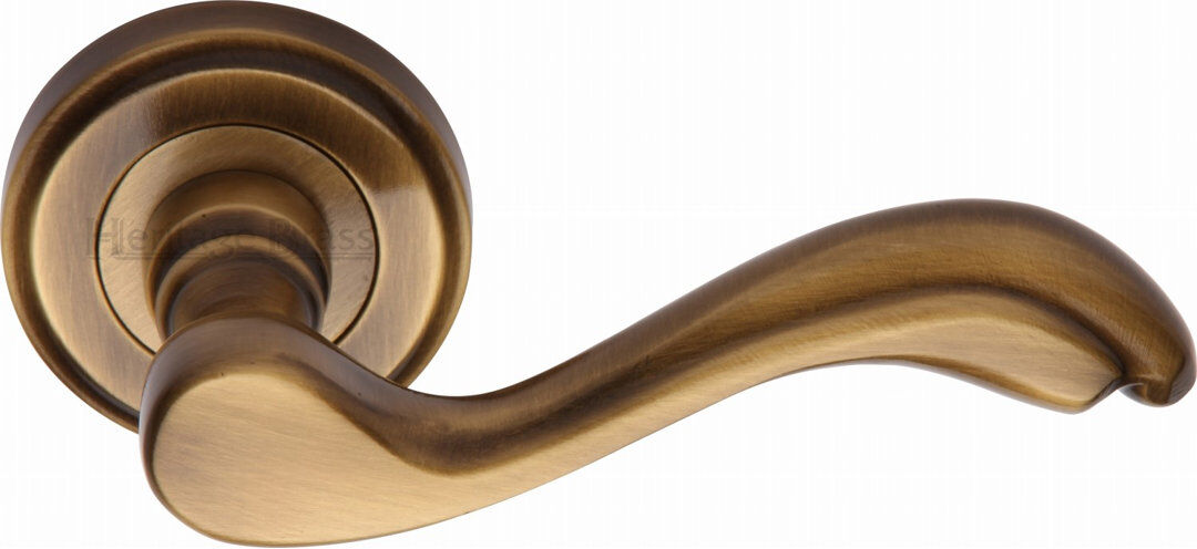 Heritage Brass Heritage Door Handle Lever Latch on Round Rose Lisboa Design Antique Brass 5.3cm H X 11.4cm W