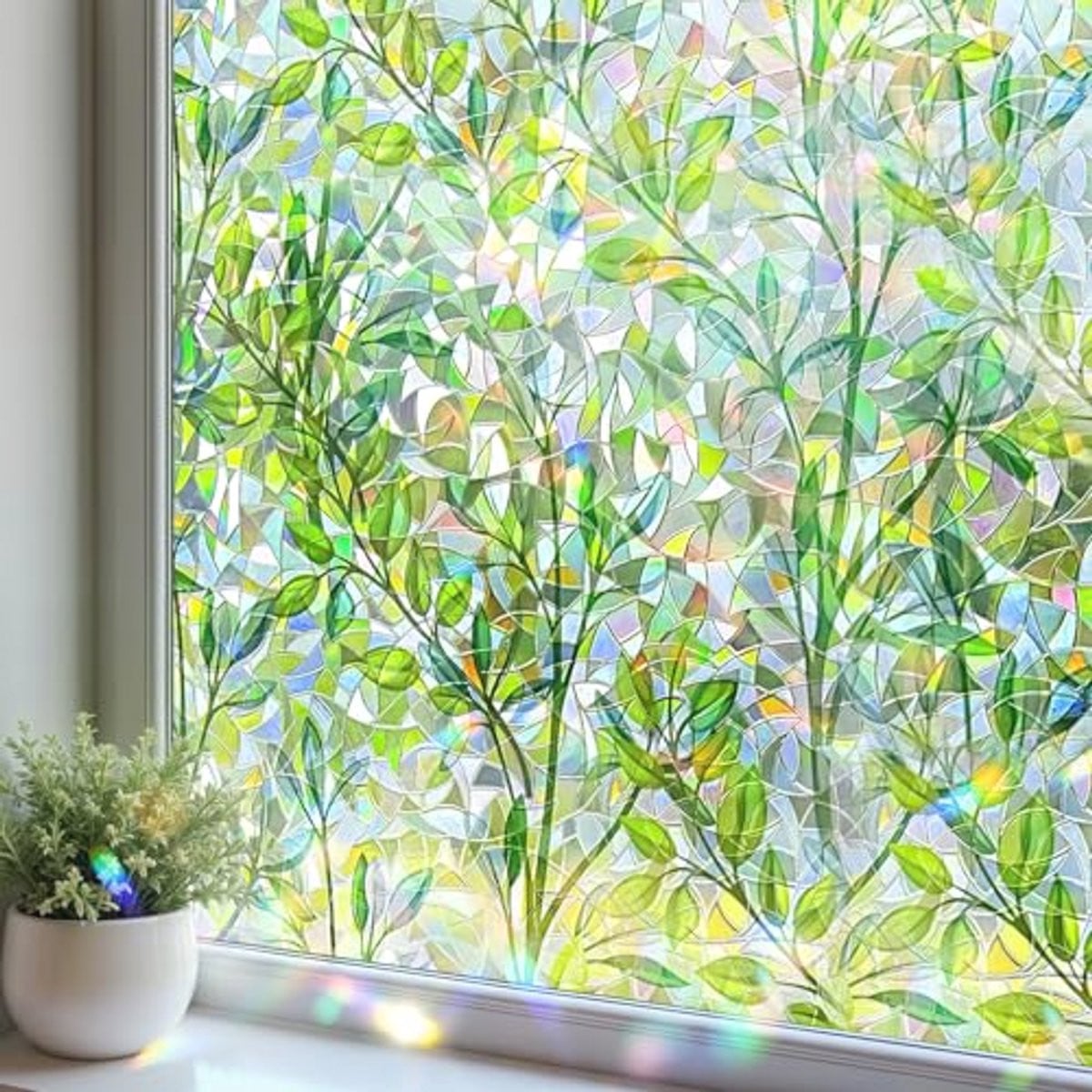 Decoratieve raamfolie met bladpatroon voor privacy en regenboogeffect