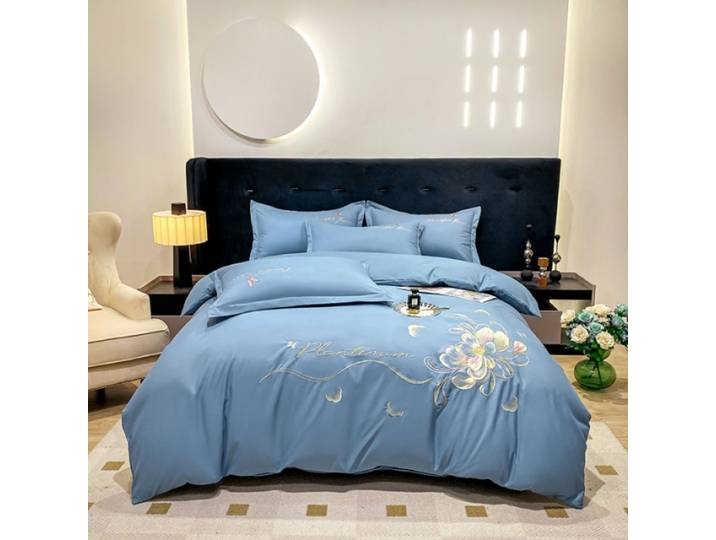 Nouveau ensemble de quatre pièces brodé haut de gamme couleur unie élégant coton respectueux de la peau literie brossée ensemble de quatre pièces ensemble de draps