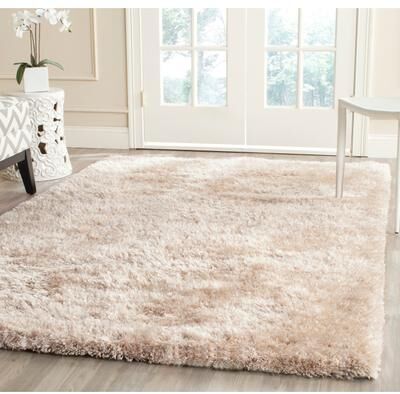 SAFAVIEH Handmade South Beach Leonella Shag Solid Polyester Rug