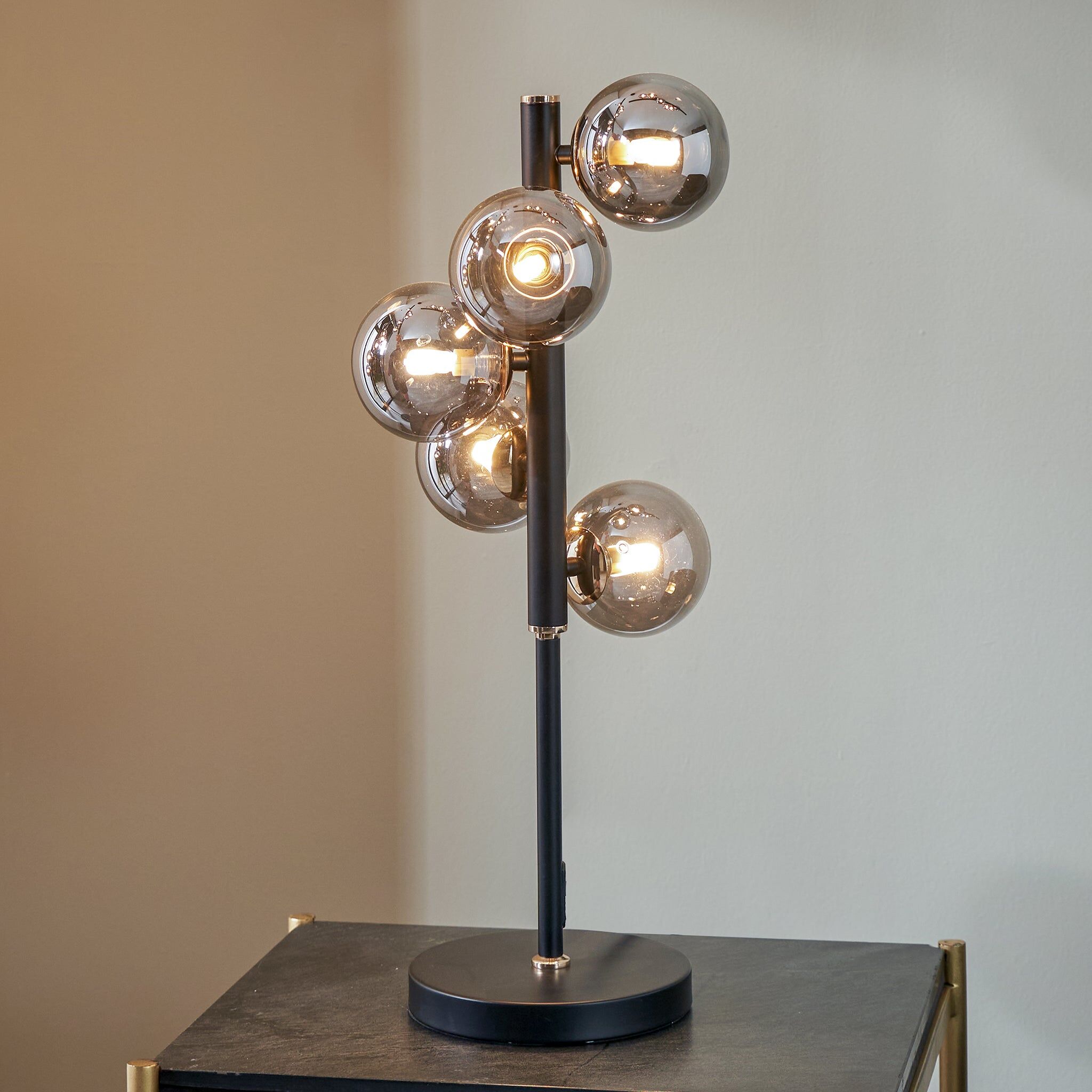 Pacific Lifestyle - Blair Smoke Glass Ball and Black Metal Table Lamp