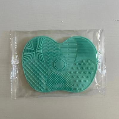 Uplifted Goods Silicone Apple Shaped Makeup Brush Cleaner Pad With Suction Cup green