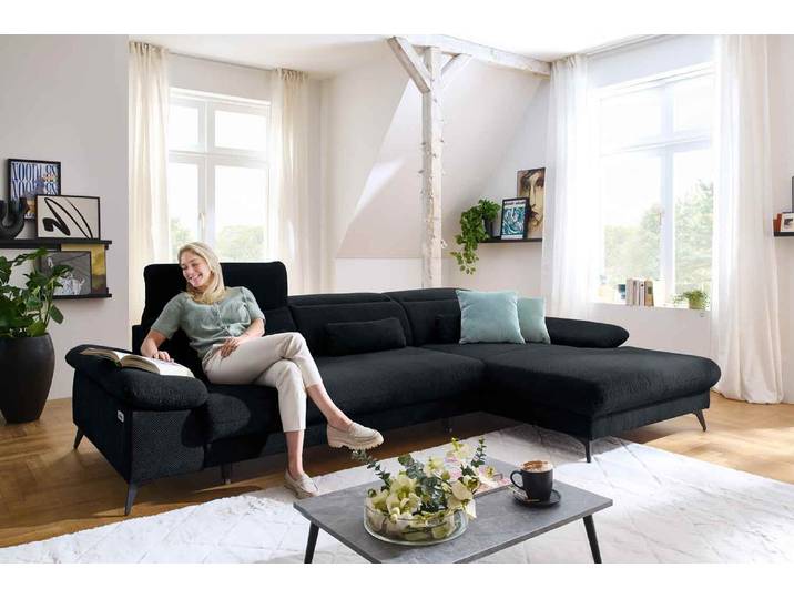 Ecksofa mit motorischen XL- Sitzvorzug in Stoff