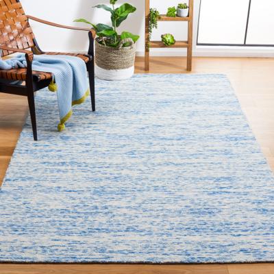SAFAVIEH Handmade Himalaya Caitlyn Modern Wool Rug