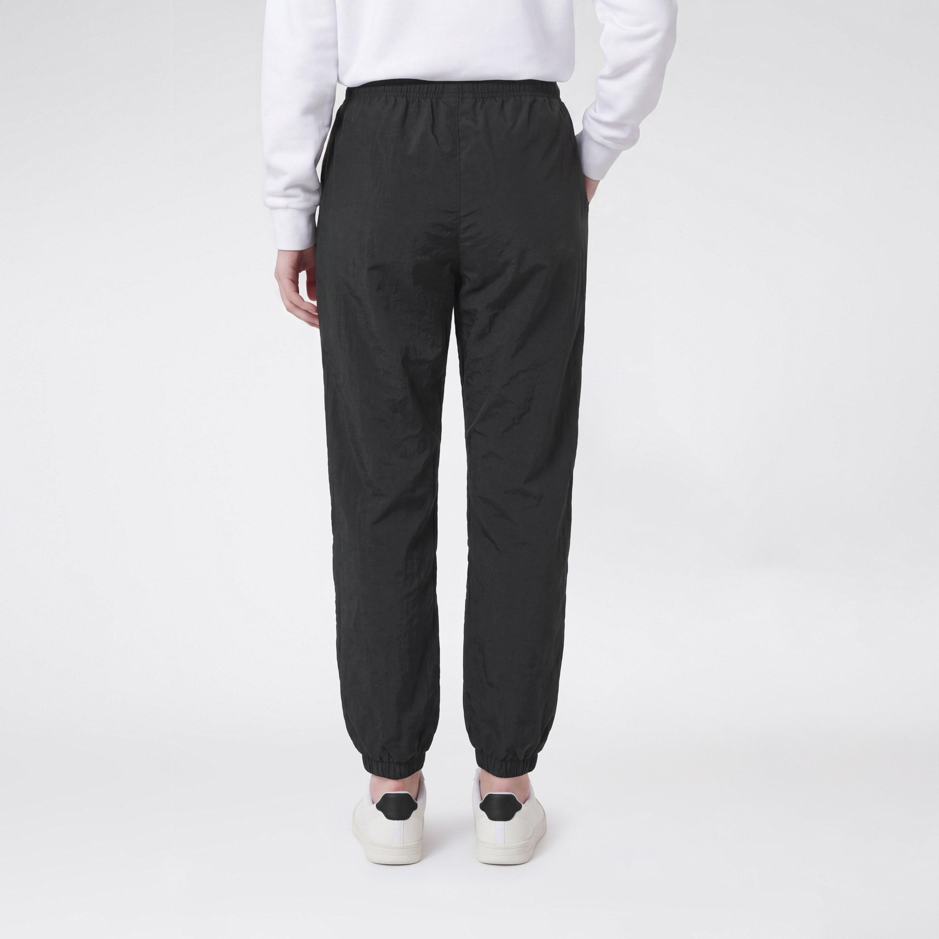 Trainingshose CHAMPION "SPORTWEAR CUFFED PANTS Loose Fit Nylon", Jungen, Gr. XL, N-Gr, nbk, Obermaterial: 100% Polyamid, Hosen Trainingshose, für Kinder, mit Cuffed-Design, auch in großen Größen, aus Polyamid