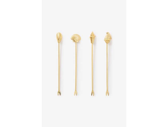 Goudkleurige prikkers met schelpen