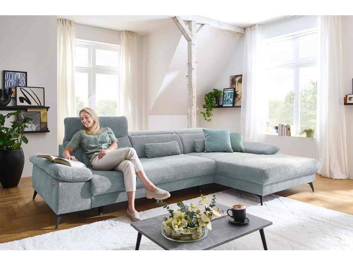 Ecksofa mit motorischen XL- Sitzvorzug in Stoff