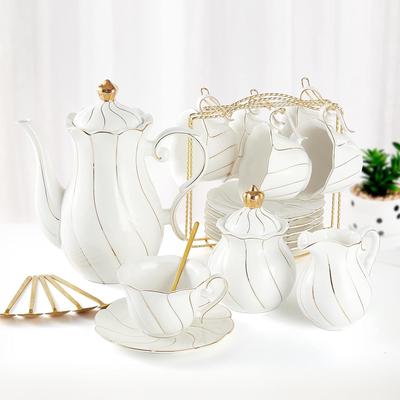 KitchenNation 22 Piece Porcelain Tea Set For 6 Luxury British Style Tea & Coffee Cups With Golden Trim white