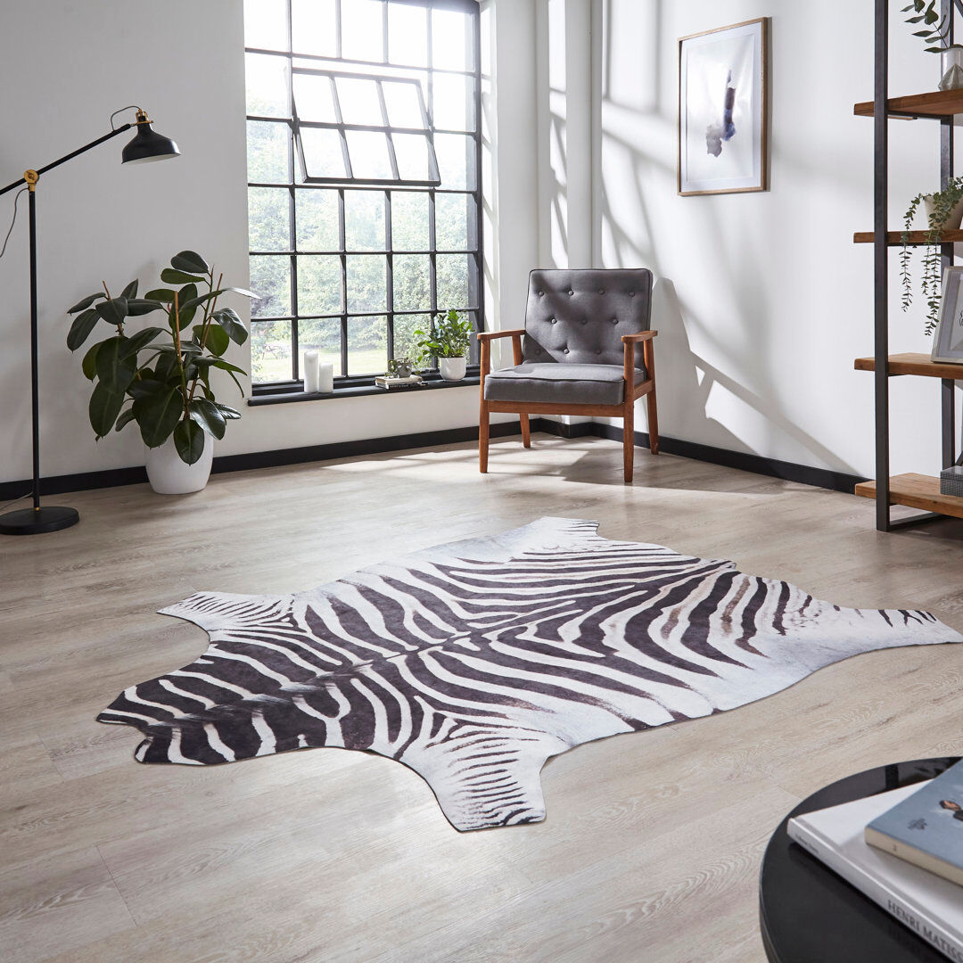 Gracie Oaks Calandra Faux Zebra Print area rug Printed Animal Skin Black Black/White Animal Skin 130 x 155cm